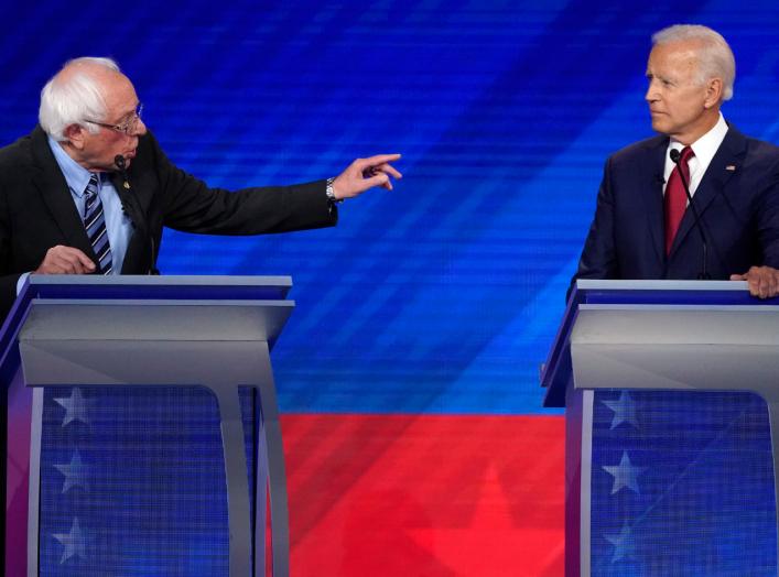 Senator Bernie Sanders gestures towards former Vice President Joe Biden (R) as he speaks during the 2020 Democratic U.S. presidential debate in Houston, Texas, U.S. September 12, 2019. REUTERS/Mike Blake