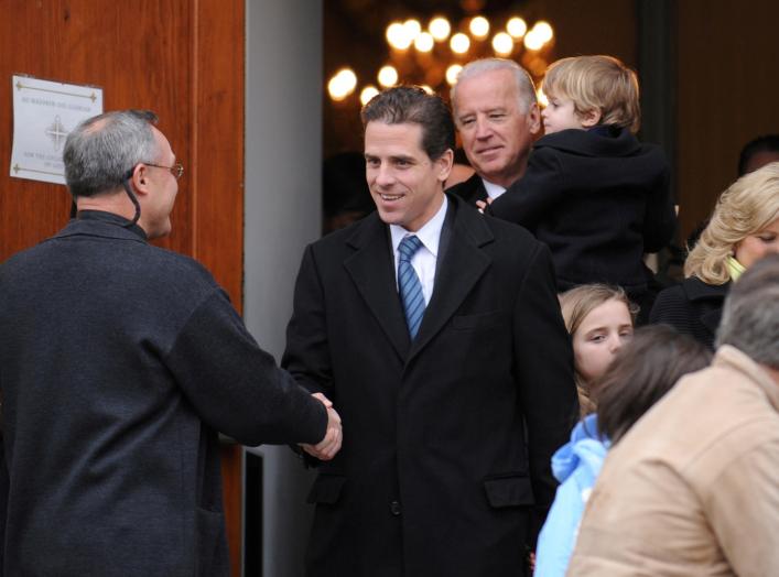 FILE PHOTO: U.S. Vice President Joe Biden and his son Hunter Biden depart after a pre-inauguration church service in Washington, U.S., January 18, 2009. REUTERS/Jonathan Ernst/File Photo