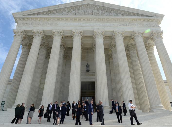 FILE PHOTO: People leave the Supreme Court after it resumed hearing oral arguments at the start of its new term in Washington, U.S., October 7, 2019. REUTERS/Mary F. Calvert/File Photo