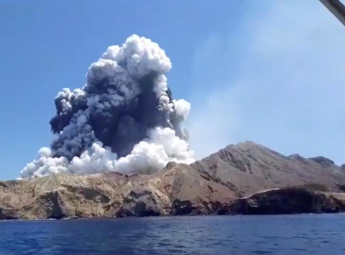 Smoke from the volcanic eruption of Whakaari, also known as White Island, is pictured from a boat, New Zealand December 9, 2019 in this picture grab obtained from a social media video. INSTAGRAM @ALLESSANDROKAUFFMANN/via REUTERS