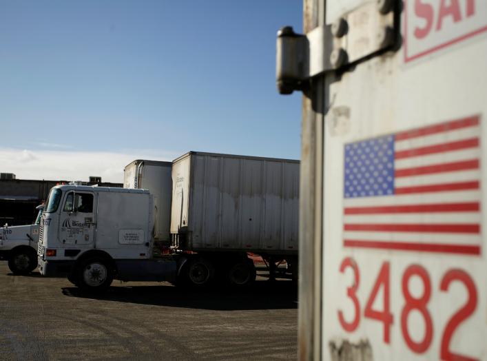 A U.S. flag is pictured on a truck loaded with merchandise at the freight shipping company Sotelo, which transports goods between Mexico and the United States, in Ciudad Juarez, Mexico, December 10, 2019. REUTERS/Jose Luis Gonzalez