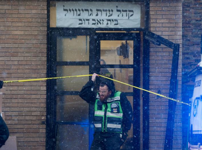 Emergency personnel and investigators work at the scene the day after an hours-long gun battle with two men around a kosher market in Jersey City, New Jersey, U.S., December 11, 2019. REUTERS/Lloyd Mitchell TPX IMAGES OF THE DAY