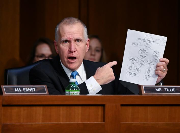 Sen. Thom Tillis (R-NC) points to a FBI chain of command chart as he questions U.S. Justice Department Inspector General Michael Horowitz (not pictured) during a Senate Judiciary Committee hearing