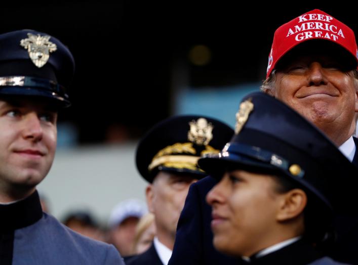 U.S President Donald Trump stands beside West Point military cadets during the annual Army-Navy collegiate football game at Lincoln Financial Field in Philadelphia, PA, U.S., December 14, 2019. REUTERS/Tom Brenner