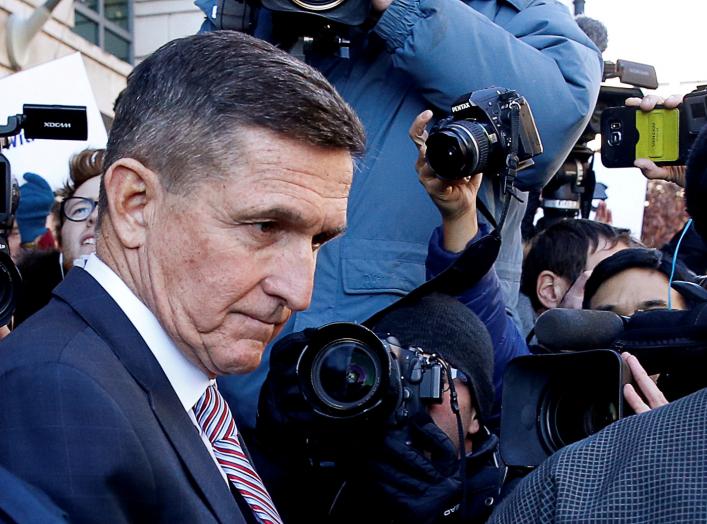 FILE PHOTO: Former U.S. national security adviser Michael Flynn passes by members of the media as he departs after his sentencing was delayed at U.S. District Court in Washington, U.S., December 18, 2018. REUTERS/Joshua Roberts/File Photo