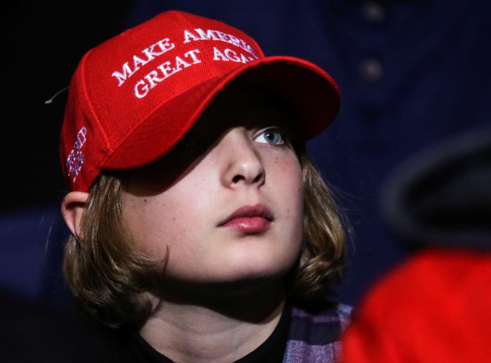 A supporter wearing a Make America Great Again (MAGA) hat attends U.S. President Donald Trump's campaign rally in Battle Creek, Michigan, U.S., December 18, 2019. REUTERS/Leah Millis?