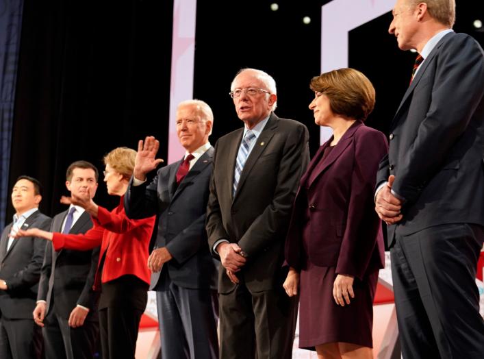 Former Vice President Joe Biden waves from among the seven Democratic presidential candidates...during the sixth 2020 U.S. Democratic presidential candidates campaign debate at Loyola Marymount University in Los Angeles, California, U.S.