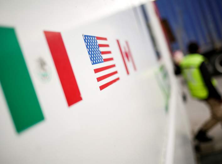 Flags of Mexico, United States and Canada are pictured at a security booth at Zaragoza-Ysleta border crossing bridge, in Ciudad Juarez, Mexico January 16, 2020. REUTERS/Jose Luis Gonzalez