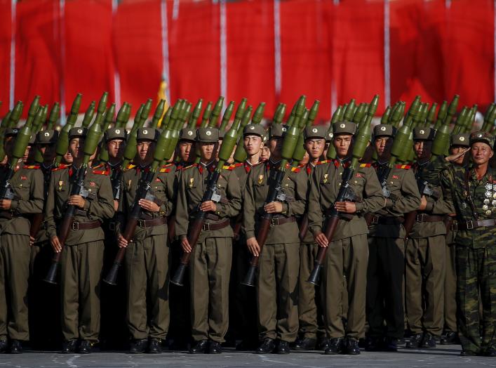 Soldiers carry rocket launchers in front of a stand with North Korean leader Kim Jong Un and other officials during the parade celebrating the 70th anniversary of the founding of the ruling Workers' Party of Korea, in Pyongyang October 10, 2015. Isolated 