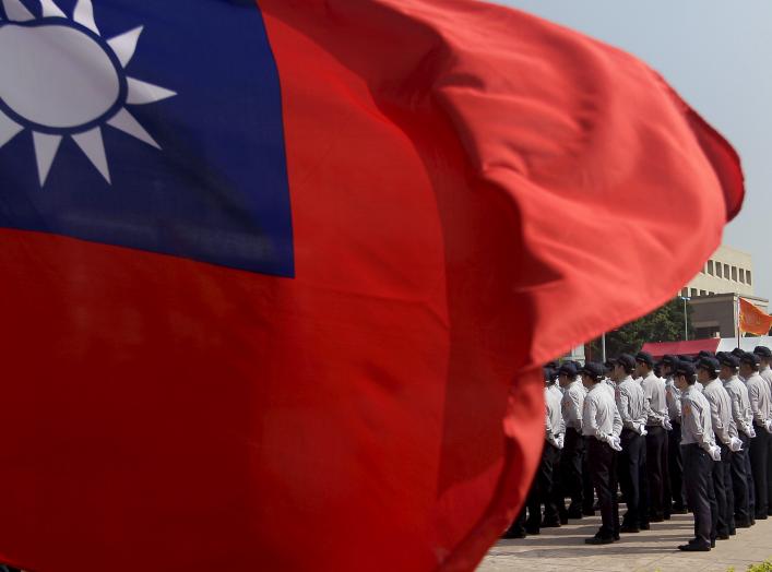 Members of the National Security Bureau take part in a drill next to a national flag at its headquarters in Taipei, Taiwan, November 13, 2015. REUTERS/Pichi Chuang