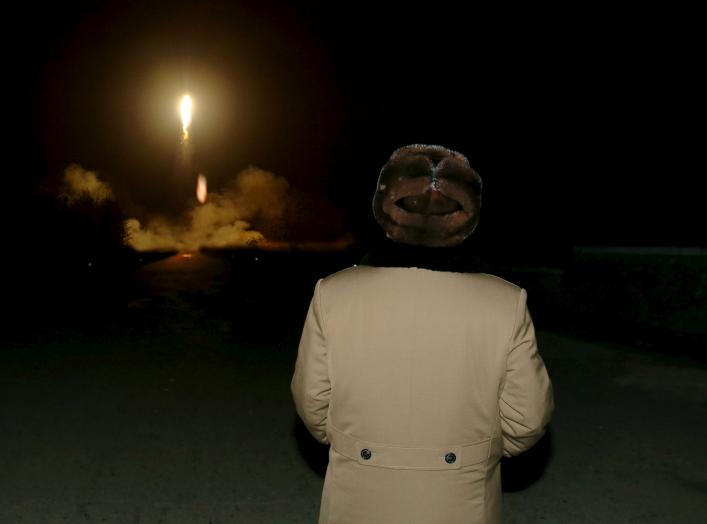 North Korean leader Kim Jong Un watches the ballistic rocket launch drill of the Strategic Force of the Korean People's Army (KPA) at an unknown location, in this undated photo released by North Korea's Korean Central News Agency (KCNA) in Pyongyang on Ma