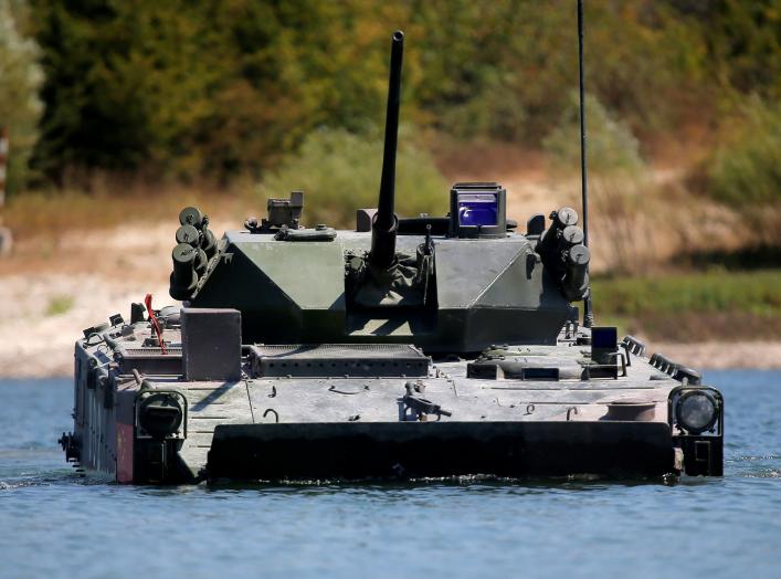 A ZBD-03 armoured infantry fighting vehicle, operated by a crew from China, drives through a water obstacle during the Paratrooper's platoon competition for airborne squads, part of the International Army Games 2016, at the Rayevsky shooting range outside