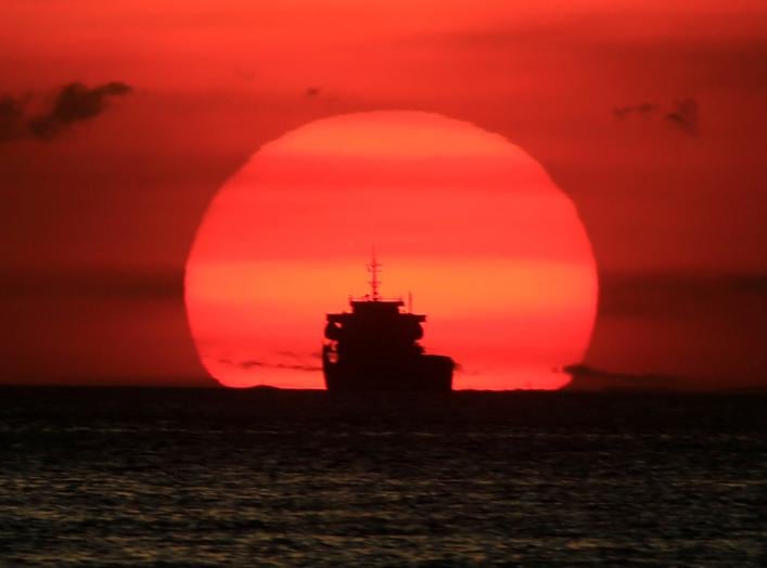 A cargo ship is silhouetted as the sun sets along the coast of Manila bay in Metro Manila, Philippines January 27, 2017. REUTERS/Romeo Ranoco