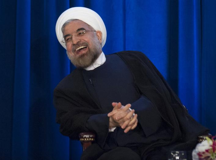 Iran's President Hassan Rouhani laughs as he speaks during an event hosted by the Council on Foreign Relations and the Asia Society in New York, September 26, 2013. REUTERS/Keith Bedford