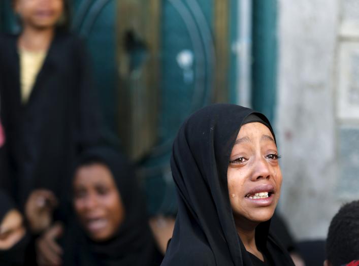 A girl cries after her father was killed by a Saudi-led air strike in Yemen's capital Sanaa July 13, 2015. Saudi-led air raids killed 21 civilians in Yemen's capital Sanaa on Monday morning, relatives of the victims and medics told Reuters, two days after