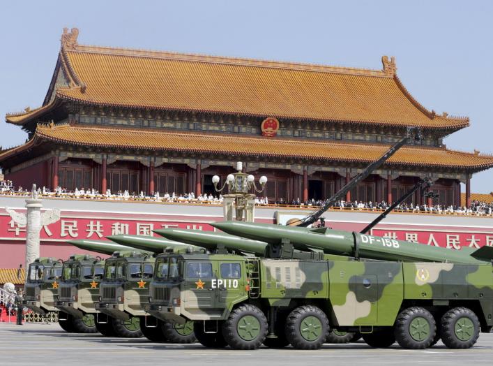 Military vehicles carrying DF-15B short-range ballistic missiles drive past the Tiananmen Gate during a military parade to mark the 70th anniversary of the end of World War Two, in Beijing, China, September 3, 2015. REUTERS/Jason Lee