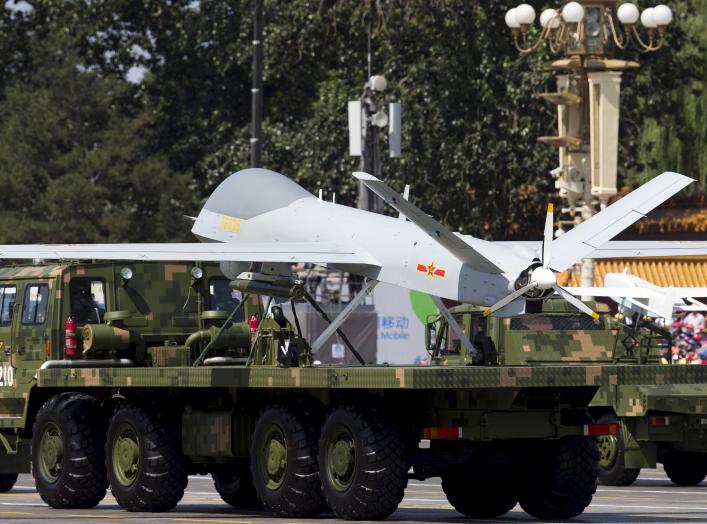 Military vehicles carrying Wing Loong, a Chinese-made medium altitude long endurance unmanned aerial vehicle, take part in a military parade to commemorate the 70th anniversary of the end of World War II in Beijing Thursday Sept. 3, 2015. REUTERS/Andy Won