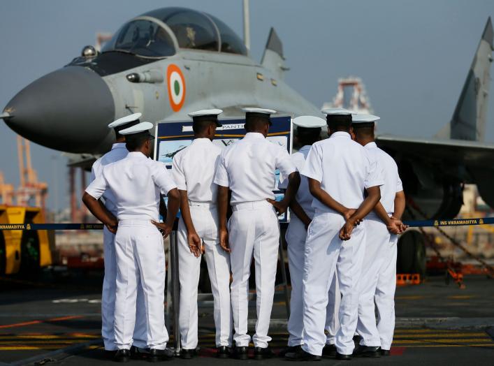 Members of the Sri Lankan navy inspect the Indian Mig fighter jets on Indian Navy's largest aircraft carrier INS Vikramaditya at Colombo port in Sri Lanka January 21, 2016. REUTERS/Dinuka Liyanawatte