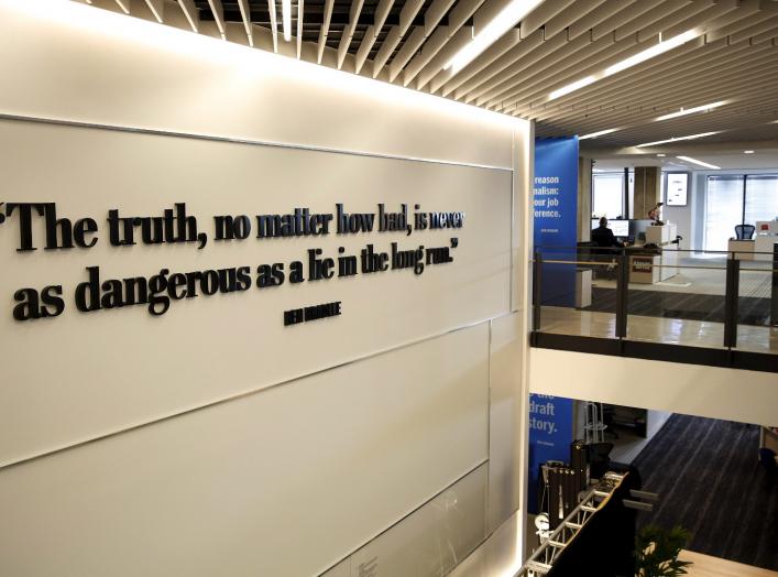 A quotation from former executive editor and journalism legend Ben Bradlee is seen on the newsroom floor during the grand opening of the Washington Post newsroom in Washington January 28, 2016. REUTERS/Gary Cameron