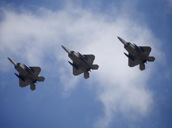  U.S. F-22 stealth fighter jets fly over Osan Air Base in Pyeongtaek, South Korea, February 17, 2016. REUTERS/Kim Hong-Ji TPX IMAGES OF THE DAY