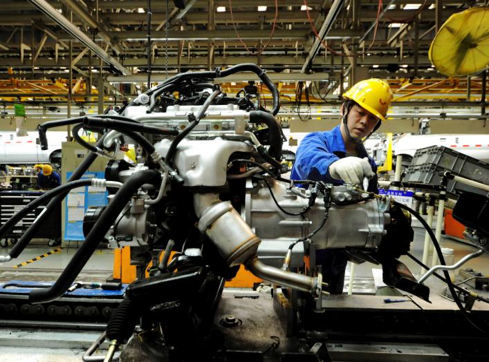 An employee works on an assembly line producing automobiles at a factory in Qingdao, Shandong Province, China, March 1, 2016. REUTERS/Stringer/File Photo