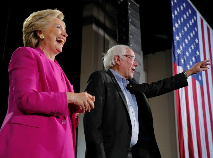 U.S. Democratic presidential nominee Hillary Clinton and U.S. Senator Bernie Sanders take the stage at a campaign rally in Raleigh, North Carolina, U.S. November 3, 2016. REUTERS/Brian Snyder