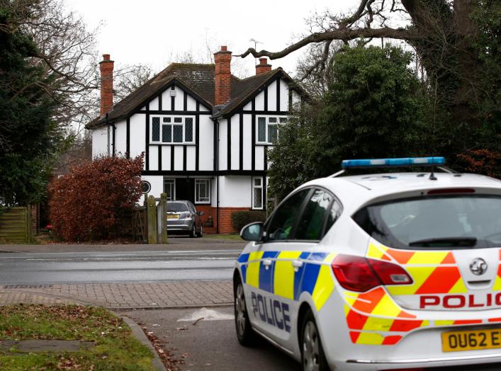 A police car drives past an address which has been linked by local media to former British intelligence officer Christopher Steele, who has been named as the author of an intelligence dossier on President-elect Donald Trump, in Wokingham, Britain