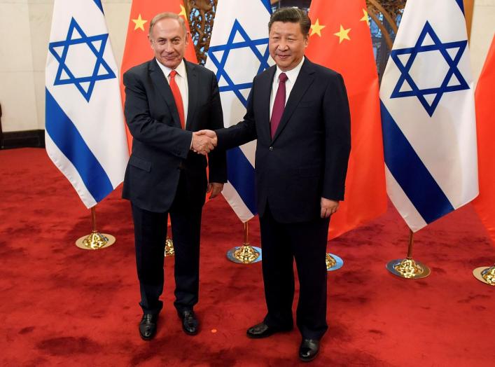 Chinese President Xi Jinping and Israeli Prime Minister Benjamin Netanyahu shake hands ahead of their talks at Diaoyutai State Guesthouse in Beijing, China March 21, 2017. REUTERS/Etienne Oliveau/Pool TPX IMAGES OF THE DAY *** Local Caption *** Xi Jinping