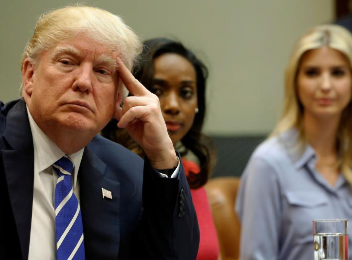 U.S. President Donald Trump (L), flanked by Johnson Security Bureau President Jessica Johnson and his daughter Ivanka Trump, meets with women small business owners at the White House in Washington, U.S. March 27, 2017. REUTERS/Jonathan Ernst TPX IMAGES OF