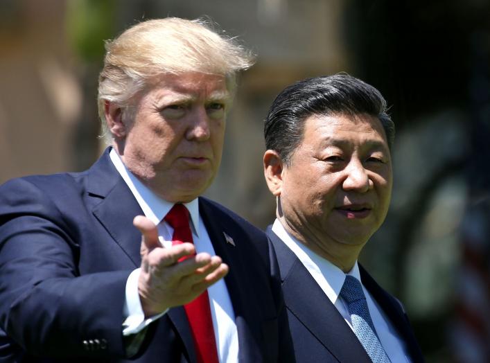 U.S. President Donald Trump and China's President Xi Jinping chat as they walk along the front patio of the Mar-a-Lago estate after a bilateral meeting in Palm Beach, Florida, U.S., April 7, 2017. REUTERS/Carlos Barria