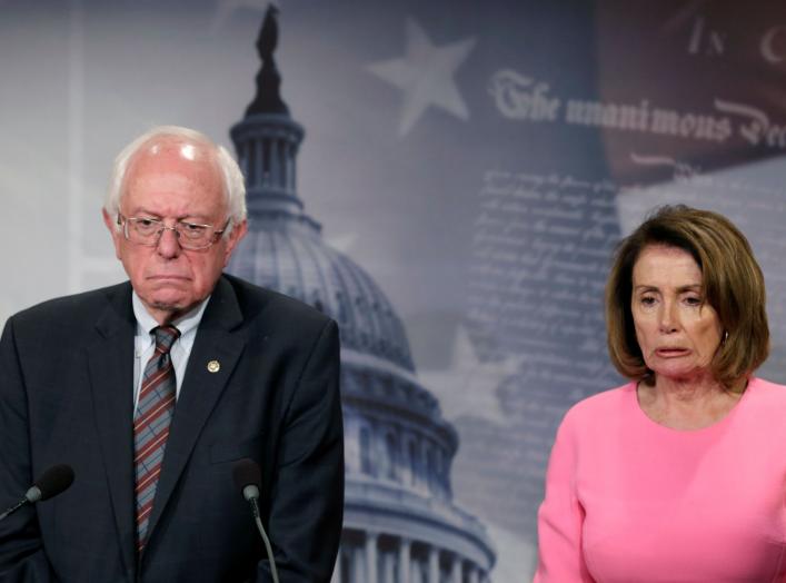 U.S. House Minority Leader Nancy Pelosi (D-CA) and Sen. Bernie Sanders (I-VT) react during a news conference on release of the president's FY2018 budget proposal on Capitol Hill in Washington, U.S., May 23, 2017. REUTERS/Yuri Gripas TPX IMAGES OF THE DAY