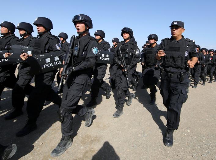 Chinese soldiers participate in an anti-terror drill in Hami, Xinjiang Uighur Autonomous Region, China, July 8, 2017. Picture taken July 8, 2017. REUTERS/Stringer 