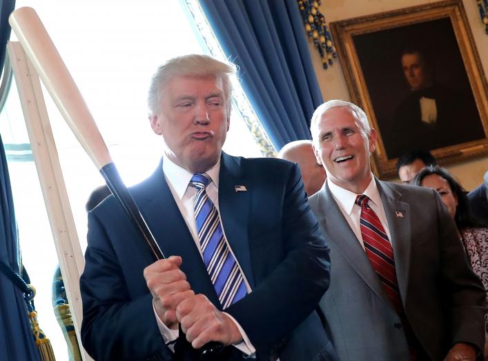 Vice President Mike Pence laughs as U.S. President Donald Trump holds a baseball bat as they attend a Made in America product showcase event at the White House in Washington, U.S., July 17, 2017. REUTERS/Carlos Barria TPX IMAGES OF THE DAY