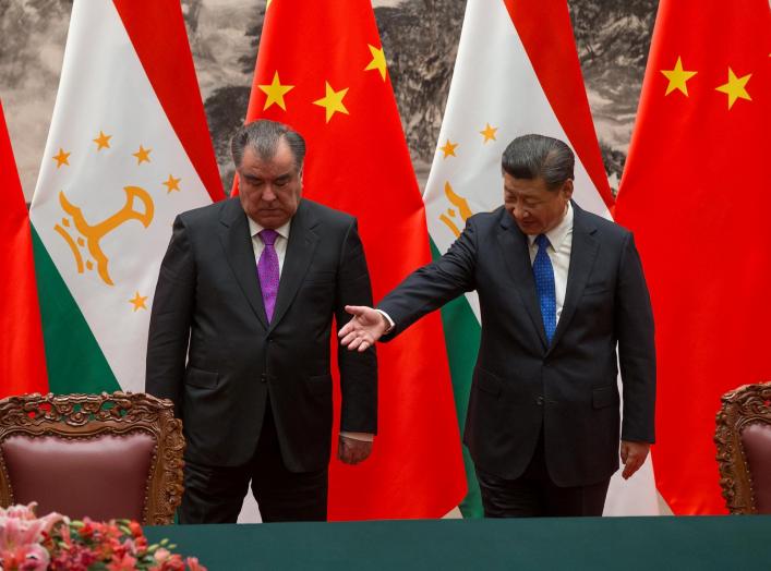 Chinese President Xi Jinping with Tajikistan's President Emomali Rahmon attend the signing ceremony during their meeting at the Great Hall of the People in Beijing, China August 31, 2017. REUTERS/Roman Pilipey/Pool