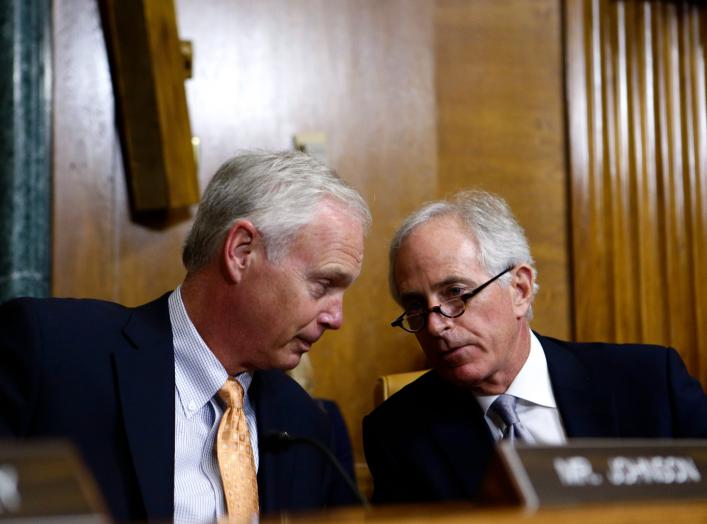 Senators Ron Johnson (R-WI) and Bob Corker (R-TN) speak during the U.S. Senate Budget Committee markup of the FY2018 Budget reconciliation legislation on Capitol Hill in Washington, U.S., November 28, 2017. REUTERS/Joshua Roberts