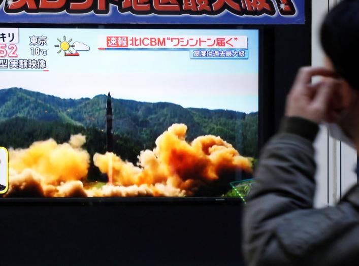 A man looks at a street monitor showing a news report about North Korea's missile launch, in Tokyo, Japan, November 29, 2017. REUTERS/Toru Hanai