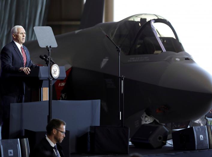 U.S. Vice President Mike Pence addresses members of U.S. military services and Japan Self-Defense Forces (JSDF) in front of a U.S. Air Force F-35 fighter before he departs for South Korea, at U.S. Air Force Yokota base in Fussa, on the outskirts of Tokyo,