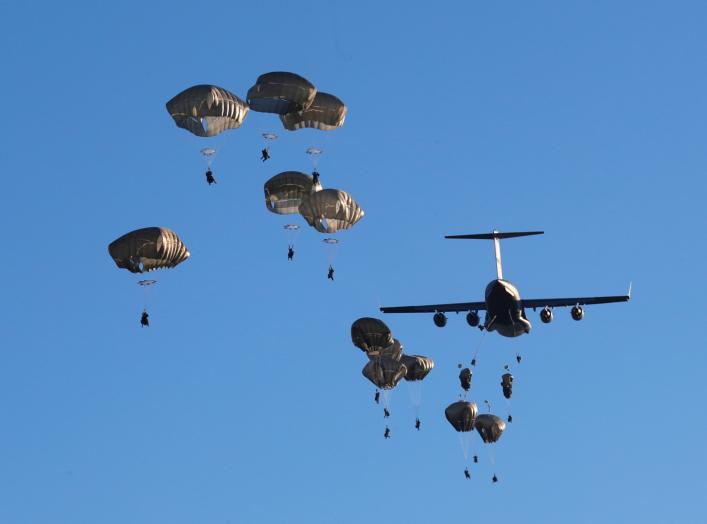 U.S. Army paratroopers leave C-17 aircraft to land during NATO exercise Swift Response 2018 on Adazi military ground, Latvia June 9, 2018. REUTERS/Ints Kalnins