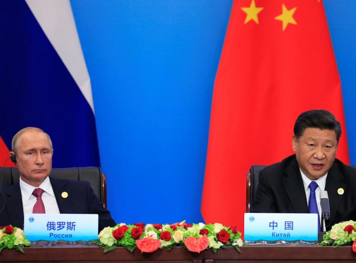 China's President Xi Jinping and Russia's President Vladimir Putin attend a signing ceremony during Shanghai Cooperation Organization (SCO) summit in Qingdao, Shandong Province, China June 10, 2018. REUTERS/Aly Song