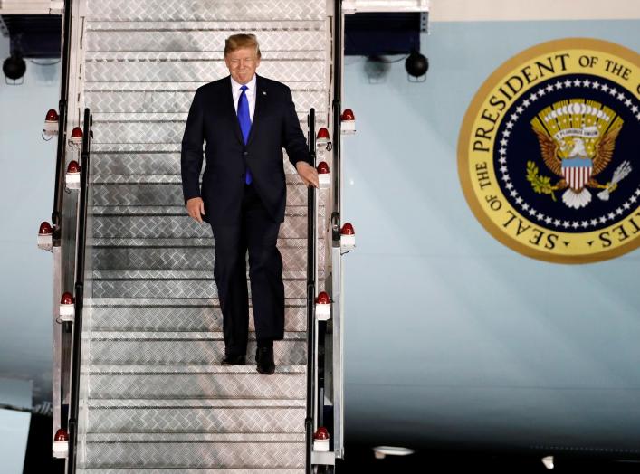 U.S. President Donald Trump steps off his plane as he arrives at Paya Lebar Air Base in Singapore, ahead of a summit with North Korean leader Kim Jong Un, June 10, 2018. REUTERS/Kim Kyung-Hoon