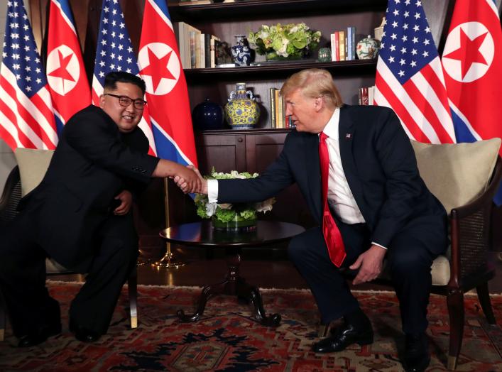 U.S. President Donald Trump shakes hands with North Korea's leader Kim Jong Un before their bilateral meeting at the Capella Hotel on Sentosa island in Singapore June 12, 2018. REUTERS/Jonathan Ernst