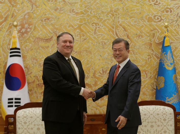 South Korean President Moon Jae-in, right, shakes hands with U.S. Secretary of State Mike Pompeo during a meeting at the presidential Blue House in Seoul, South Korea Ocober 7, 2018. Ahn Young-joon/Pool via REUTERS