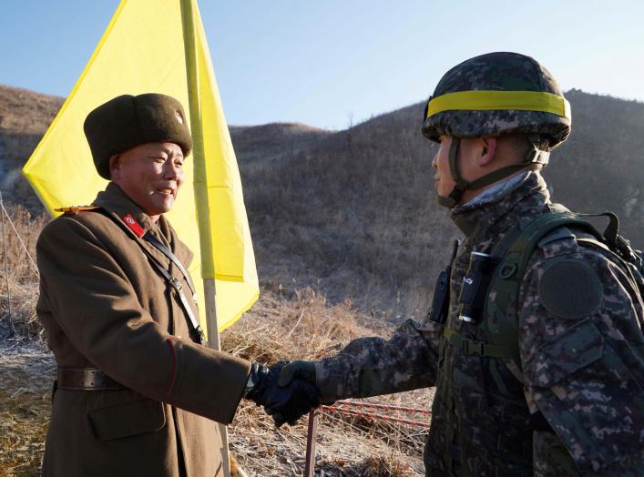 Soldiers from North and South Korea verify the removal of guard posts on each side of the Demilitarized Zone, December 12, 2018. South Korean Defence Ministry/Handout via REUTERS THIS IMAGE HAS BEEN SUPPLIED BY A THIRD PARTY.