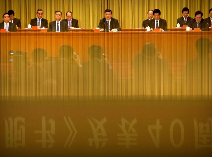 A banner is reflected on a polished surface as Chinese President Xi Jinping (C) speaks during an event to commemorate the 40th anniversary of the "Message to Compatriots in Taiwan" at the Great Hall of the People in Beijing, China January 2, 2019. REUTERS