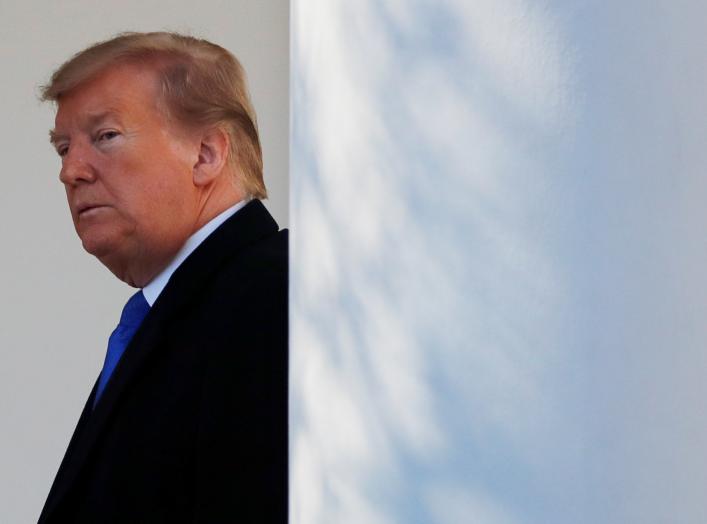 U.S. President Donald Trump heads back to the Oval Office after declaring a national emergency at the U.S.-Mexico border during remarks about border security in the Rose Garden of the White House in Washington, U.S., February 15, 2019. REUTERS/Carlos Barr