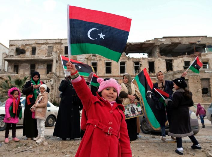 A child carries the flag of Libya during a celebration of the eighth anniversary of the revolution, in Benghazi, Libya February 17, 2019. REUTERS/Esam Omran Al-Fetori