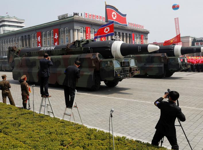 FILE PHOTO: Missiles are driven past the stand with North Korean leader Kim Jong Un and other high ranking officials during a military parade marking the 105th birth anniversary of the country's founding father Kim Il Sung, in Pyongyang April 15, 2017. RE