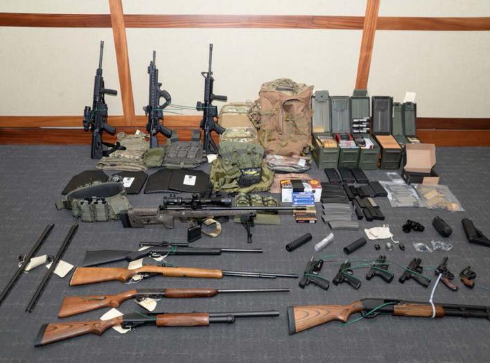 A cache of guns and ammunition uncovered by U.S. federal investigators in the home of U.S. Coast Guard lieutenant Christopher Paul Hasson in Silver Spring, Maryland, U.S., is shown in the photo provided February 20, 2019. U.S. Attorney's Office Maryland/H