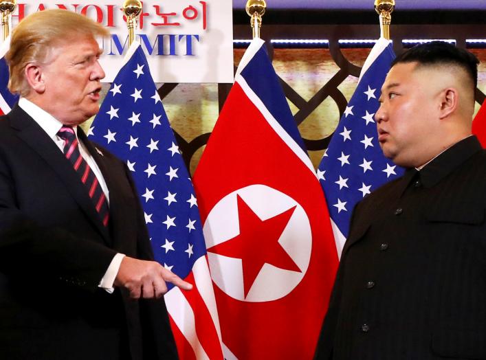 U.S. President Donald Trump speaks to North Korean leader Kim Jong Un after shaking hands before their one-on-one chat during the second U.S.-North Korea summit at the Metropole Hotel in Hanoi, Vietnam February 27, 2019. REUTERS/Leah Millis