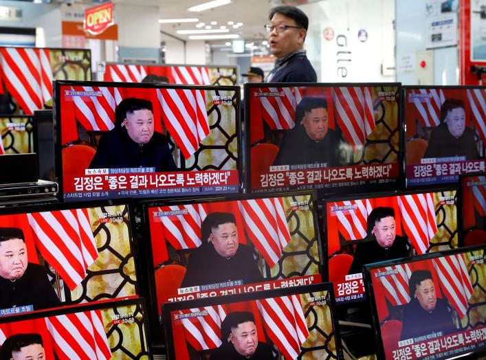 A clerk watches a set of TV's broadcasting a news report on a Hanoi summit between North Korean leader Kim Jong Un and U.S. President Donald Trump, in Seoul, South Korea, February 28, 2019. REUTERS/Kim Hong-Ji